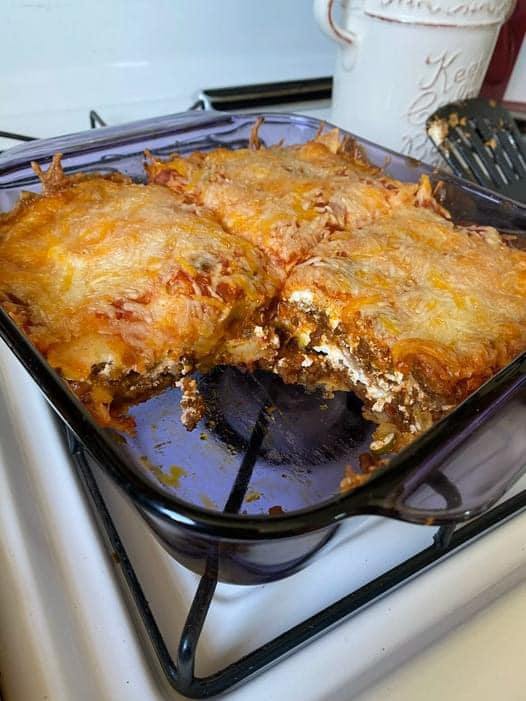 Taco Lasagna Recipe: A Fusion of Flavorful Delights  Prepare to embark on a culinary adventure with our tantalizing Taco Lasagna recipe. This delightful fusion dish combines the bold flavors of traditional Mexican tacos with the comforting layers of Italian lasagna, resulting in a mouthwatering masterpiece that’s sure to impress. Perfect for family dinners or casual gatherings, our Taco Lasagna is guaranteed to become a new favorite in your recipe repertoire.  Ingredients:  1 pound of ground beef 1 onion, diced 2 cloves of garlic, minced 1 packet (1 ounce) of taco seasoning 1 can (15 ounces) of black beans, drained and rinsed 1 can (15 ounces) of corn, drained 1 can (10 ounces) of diced tomatoes with green chilies, undrained 1 can (8 ounces) of tomato sauce 12 lasagna noodles, cooked according to package instructions 2 cups of shredded Mexican blend cheese Optional toppings: sour cream, avocado slices, chopped cilantro, sliced jalapenos For Ingredients And Complete Cooking Instructions Please Head On Over To Next Page Or Open button (>) and don’t forget to SHARE with your Facebook friends